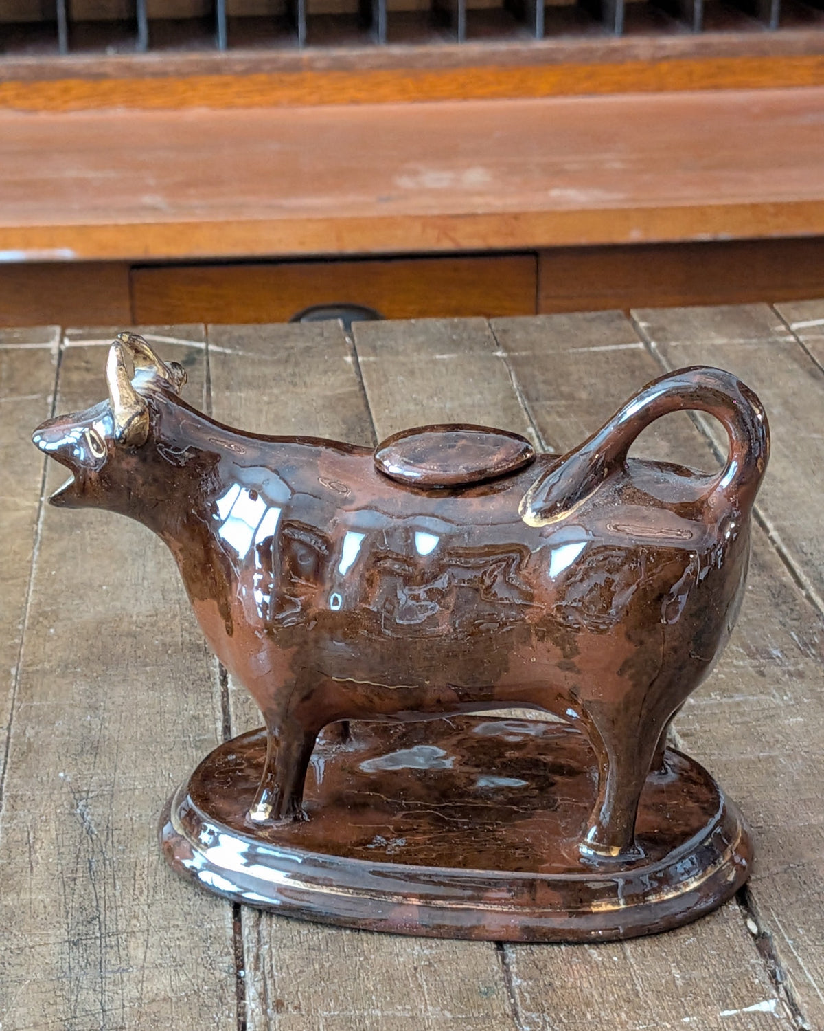 British Jackfield Brown Cow Creamer with Saddle Lid, c1850-1890