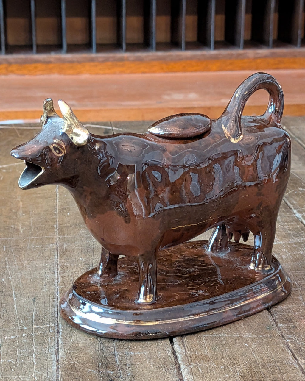 British Jackfield Brown Cow Creamer with Saddle Lid, c1850-1890
