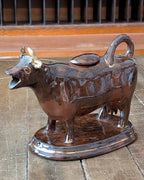 British Jackfield Brown Cow Creamer with Saddle Lid, c1850-1890
