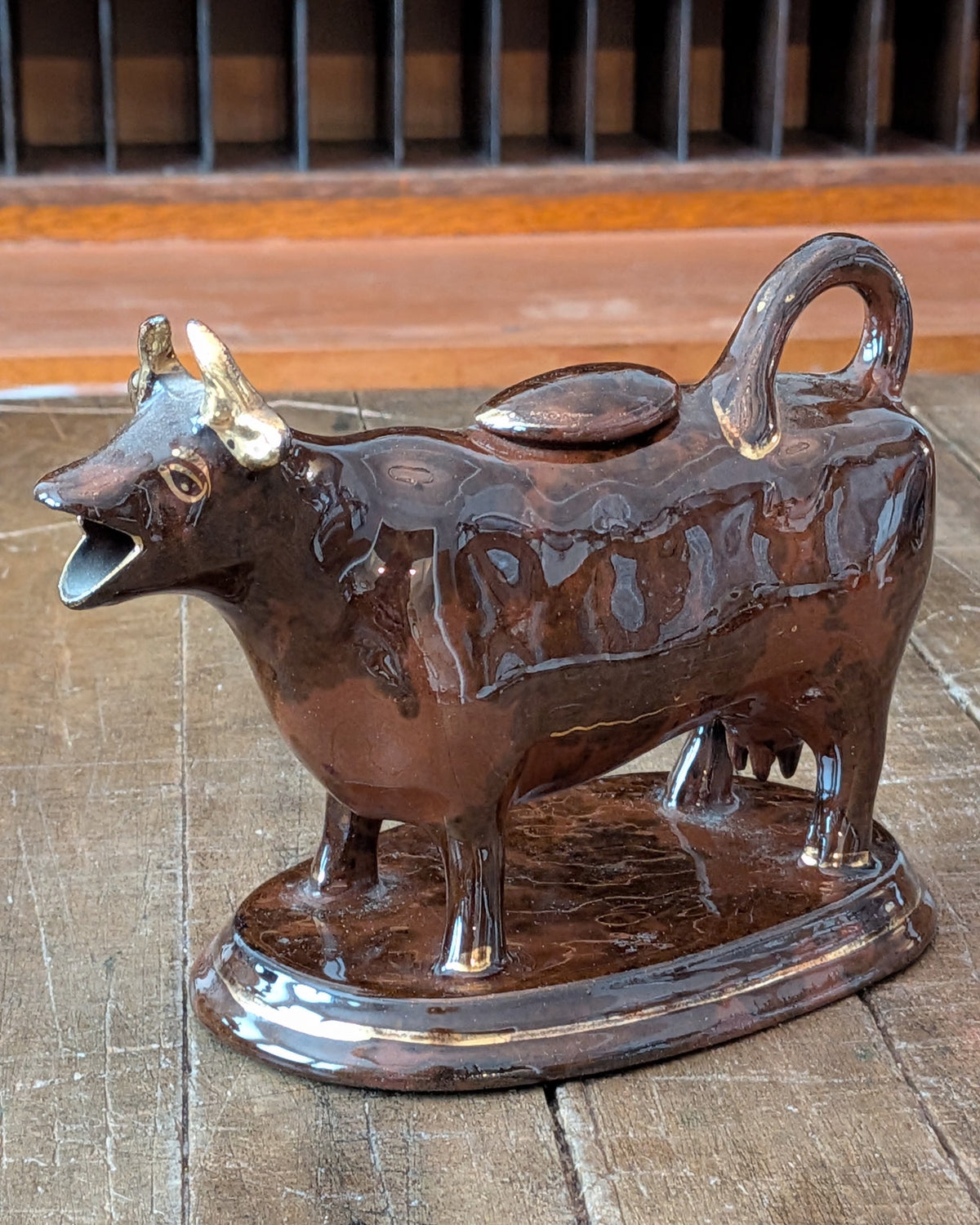 British Jackfield Brown Cow Creamer with Saddle Lid, c1850-1890