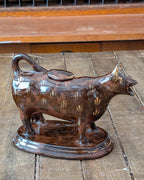 British Jackfield Brown Cow Creamer with Saddle Lid, c1850-1890